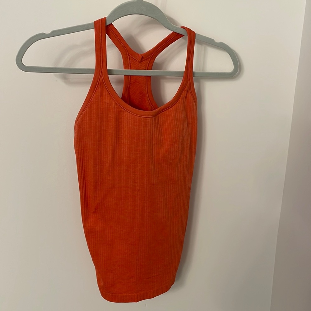 Orange Lululemon tank with built in padding